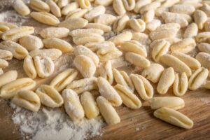 Cavatelli,Pasta,On,Wooden,Cutting,Board.,Italian,Cuisine.